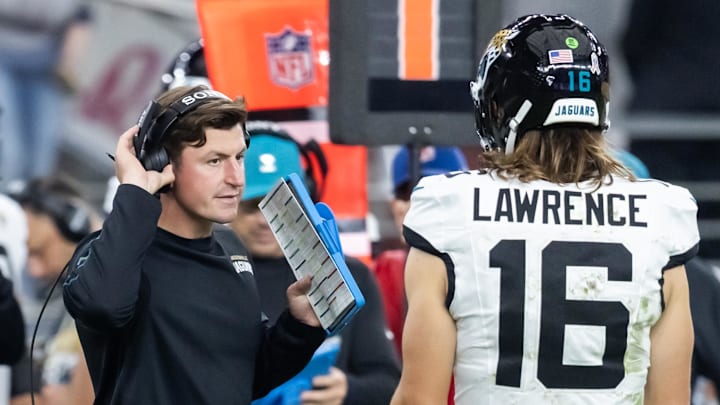 Nov 23, 2025; Glendale, Arizona, USA; Jacksonville Jaguars offensive coordinator Grant Udinski with quarterback Trevor Lawrence (16) against the Arizona Cardinals at State Farm Stadium. Mandatory Credit: Mark J. Rebilas-Imagn Images
