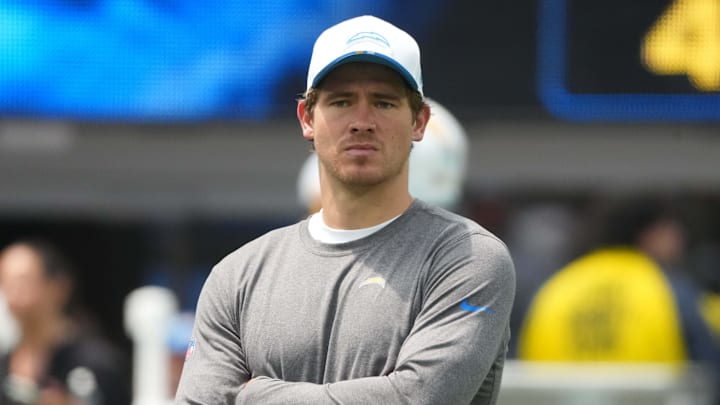 Aug 10, 2025; Inglewood, California, USA; Los Angeles Chargers quarterback Justin Herbert watches during the game against the New Orleans Saints at SoFi Stadium. Mandatory Credit: Kirby Lee-Imagn Images
