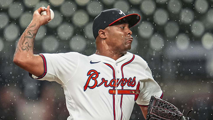 Aug 20, 2025; Cumberland, Georgia, USA; Atlanta Braves relief pitcher Raisel Iglesias (26) pitches against the Chicago White Sox during the ninth inning at Truist Park. Mandatory Credit: Dale Zanine-Imagn Images
