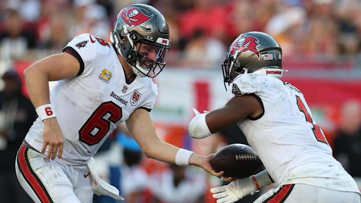 Oct 12, 2025; Tampa, Florida, USA; Tampa Bay Buccaneers quarterback Baker Mayfield (6) hands the ball off to running back Rachaad White (1) during the third quarter against the San Francisco 49ers at Raymond James Stadium. Mandatory Credit: Nathan Ray Seebeck-Imagn Images