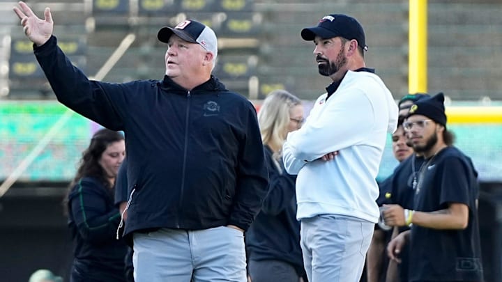 Oct 12, 2024; Eugene, Oregon, USA; Ohio State Buckeyes head coach Ryan Day talks to offensive coordinator Chip Kelly prior to the NCAA football game against the Oregon Ducks at Autzen Stadium