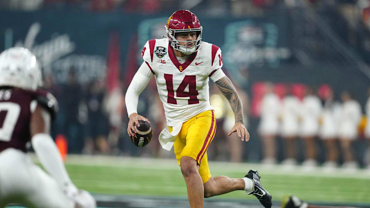 Dec 27, 2024; Las Vegas, NV, USA; Southern California Trojans quarterback Jayden Maiava (14) throws the ball against the Texas A&M Aggies in the first half at Allegiant Stadium. Mandatory Credit: Kirby Lee-Imagn Images Dec 27, 2024; Las Vegas, NV, USA; Southern California Trojans quarterback Jayden Maiava (14) throws the ball against the Texas A&M Aggies in the first half at Allegiant Stadium. Mandatory Credit: Kirby Lee-Imagn Images