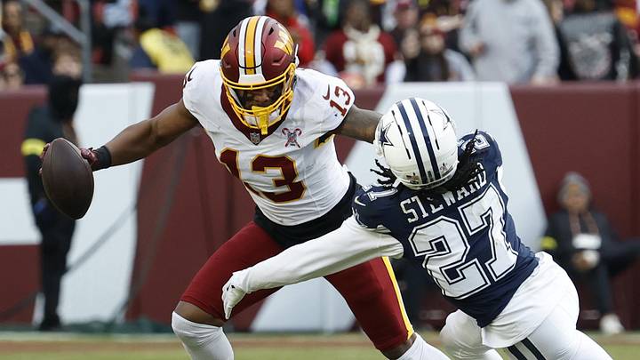 Dec 25, 2025; Landover, Maryland, USA; Washington Commanders wide receiver Treylon Burks (13) runs with the ball as Dallas Cowboys cornerback Reddy Steward (27) chases during the second half at Northwest Stadium. Mandatory Credit: Geoff Burke-Imagn Images Dec 25, 2025; Landover, Maryland, USA; Washington Commanders wide receiver Treylon Burks (13) runs with the ball as Dallas Cowboys cornerback Reddy Steward (27) chases during the second half at Northwest Stadium. Mandatory Credit: Geoff Burke-Imagn Images
