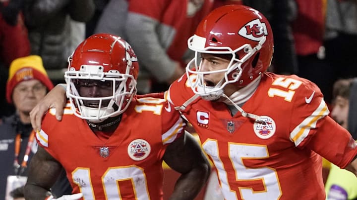 Jan 23, 2022; Kansas City, Missouri, USA; Kansas City Chiefs quarterback Patrick Mahomes (15) celebrates with wide receiver Tyreek Hill (10) after Hill scored against the Buffalo Bills during an AFC Divisional playoff football game at GEHA Field at Arrowhead Stadium. Mandatory Credit: Denny Medley-Imagn Images