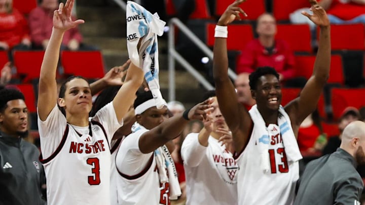 Dec 6, 2025; Raleigh, North Carolina, USA; NC State Wolfpack neck celebrates during the second half of the game against the Liberty Flames at Lenovo Center. Mandatory Credit: Jaylynn Nash-Imagn Images Dec 6, 2025; Raleigh, North Carolina, USA; NC State Wolfpack neck celebrates during the second half of the game against the Liberty Flames at Lenovo Center. Mandatory Credit: Jaylynn Nash-Imagn Images