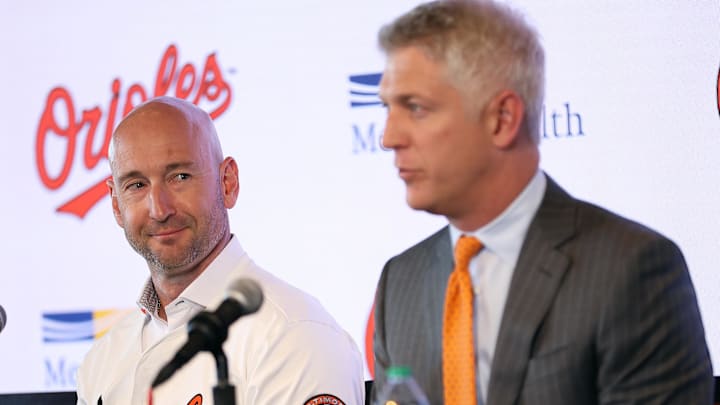 Nov 4, 2025; Baltimore, MD, USA; Left: Craig Albernaz looks at Right: President of Baseball Operations Mike Elias after being introduced as the Baltimore Orioles new Manager at Warehouse Bar. Mandatory Credit: Daniel Kucin Jr.-Imagn Images