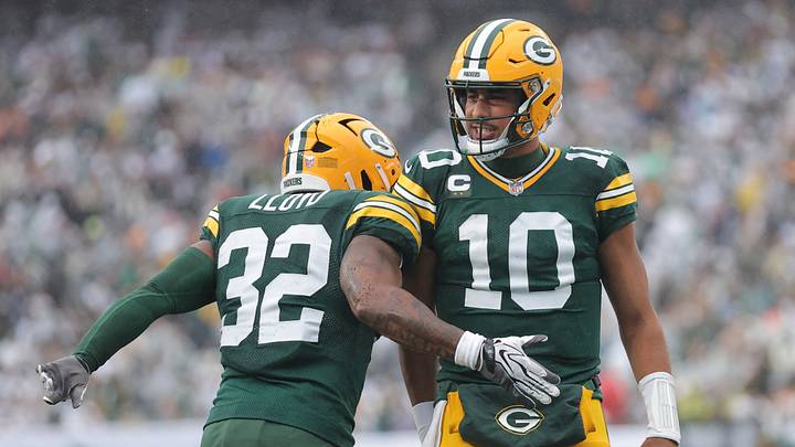 Green Bay Packers running back MarShawn Lloyd (32) celebrates with quarterback Jordan Love after catching a touchdown pass. Green Bay Packers running back MarShawn Lloyd (32) celebrates with quarterback Jordan Love after catching a touchdown pass.