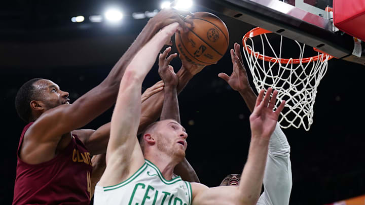 Oct 29, 2025; Boston, Massachusetts, USA; Cleveland Cavaliers center Evan Mobley (4) works for the ball against Boston Celtics forward Sam Hauser (30) and guard/forward Jaylen Brown (7) in the second half at TD Garden. Mandatory Credit: David Butler II-Imagn Images Oct 29, 2025; Boston, Massachusetts, USA; Cleveland Cavaliers center Evan Mobley (4) works for the ball against Boston Celtics forward Sam Hauser (30) and guard/forward Jaylen Brown (7) in the second half at TD Garden. Mandatory Credit: David Butler II-Imagn Images