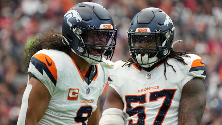Denver Broncos safety Talanoa Hufanga (9) and linebacker Dre Greenlaw (57)