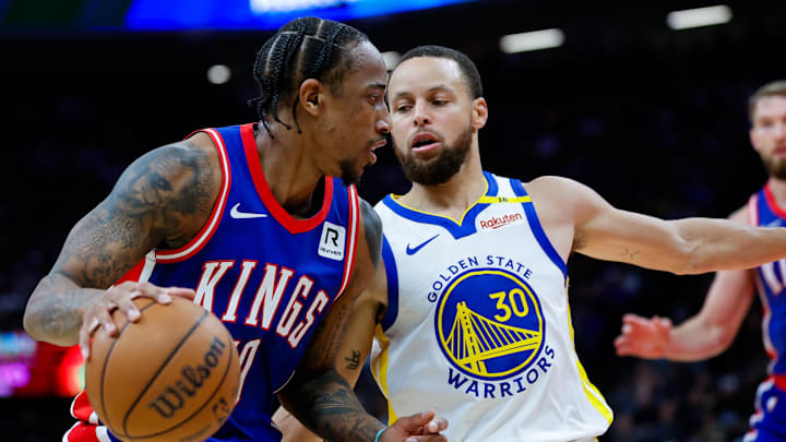 Feb 21, 2025; Sacramento, California, USA; Sacramento Kings forward DeMar DeRozan (10) dribbles the ball against Golden State Warriors guard Stephen Curry (30) during the second quarter at Golden 1 Center. Feb 21, 2025; Sacramento, California, USA; Sacramento Kings forward DeMar DeRozan (10) dribbles the ball against Golden State Warriors guard Stephen Curry (30) during the second quarter at Golden 1 Center.