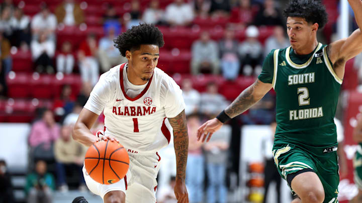 Dec 17, 2025; Tuscaloosa, Alabama, USA; Alabama Crimson Tide guard Jalil Bethea (1) goes on a fast break guarded by South Florida Bulls guard Wes Enis (2) during the second half at Coleman Coliseum. Mandatory Credit: David Leong-Imagn Images