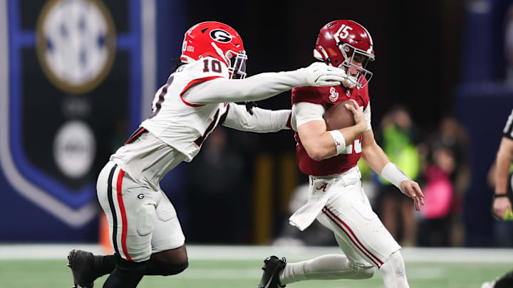 Dec 6, 2025; Atlanta, GA, USA; Alabama Crimson Tide quarterback Ty Simpson (15) scrambles and is tackled by Georgia Bulldogs linebacker Zayden Walker (10) during the fourth quarter during the 2025 SEC Championship game at Mercedes-Benz Stadium. Mandatory Credit: Brett Davis-Imagn Images Dec 6, 2025; Atlanta, GA, USA; Alabama Crimson Tide quarterback Ty Simpson (15) scrambles and is tackled by Georgia Bulldogs linebacker Zayden Walker (10) during the fourth quarter during the 2025 SEC Championship game at Mercedes-Benz Stadium. Mandatory Credit: Brett Davis-Imagn Images