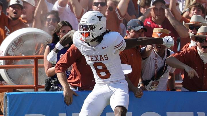 Texas Longhorns wide receiver Cam Coleman (8) celebrates after scoring a touchdown against the Oklahoma Sooners during the first half at Cotton Bowl. Texas Longhorns wide receiver Cam Coleman (8) celebrates after scoring a touchdown against the Oklahoma Sooners during the first half at Cotton Bowl.