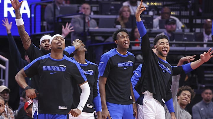 Jan 1, 2025; Houston, Texas, USA; Dallas Mavericks bench players react after a basket by guard Klay Thompson (not pictured) during the first quarter against the Houston Rockets at Toyota Center. Mandatory Credit: Troy Taormina-Imagn Images Jan 1, 2025; Houston, Texas, USA; Dallas Mavericks bench players react after a basket by guard Klay Thompson (not pictured) during the first quarter against the Houston Rockets at Toyota Center. Mandatory Credit: Troy Taormina-Imagn Images