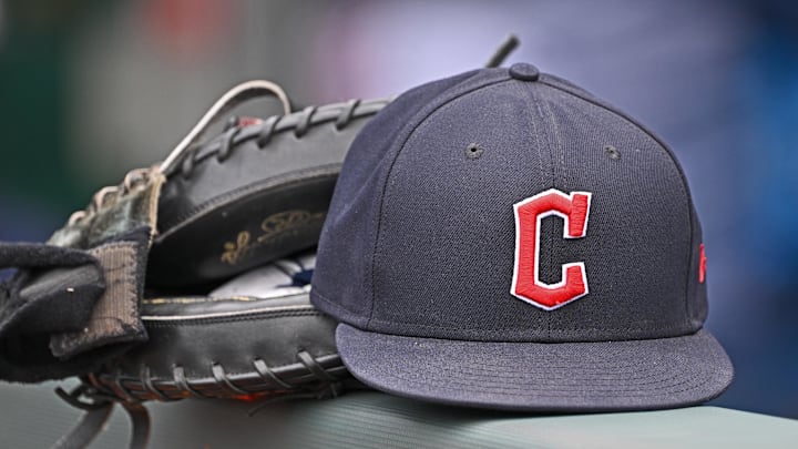 Guardians hat and glove on a railing balancing Guardians hat and glove on a railing balancing