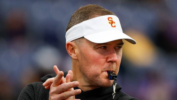 Nov 2, 2024; Seattle, Washington, USA; USC Trojans head coach Lincoln Riley watches pregame warmups against the Washington Huskies at Alaska Airlines Field at Husky Stadium. Nov 2, 2024; Seattle, Washington, USA; USC Trojans head coach Lincoln Riley watches pregame warmups against the Washington Huskies at Alaska Airlines Field at Husky Stadium.