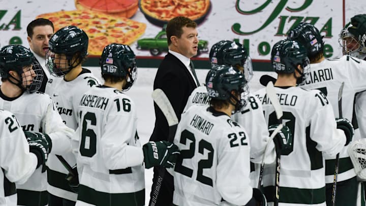 MSU hockey coach Adam Nightingale and his Spartans gather on the ice following MSU's 4-3 win over Notre Dame, Saturday, Nov. 15, 2024.