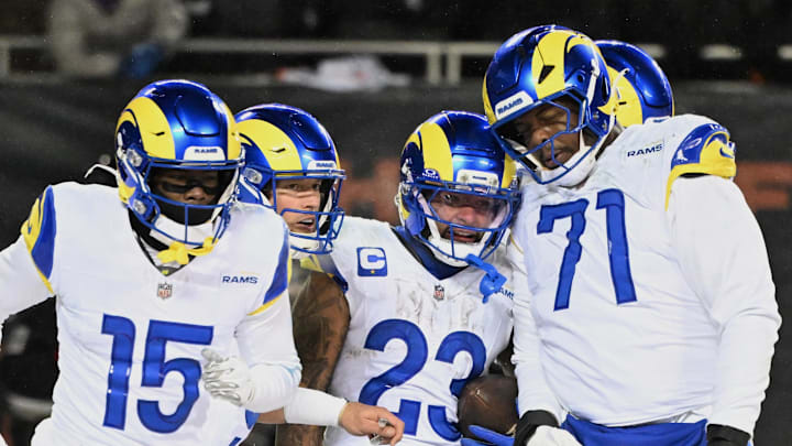 Jan 18, 2026; Chicago, IL, USA; Los Angeles Rams running back Kyren Williams (23) celebrates with wide receiver Konata Mumpfield (15), quarterback Matthew Stafford (9) and offensive tackle Warren McClendon Jr. (71) after scoring a touchdown against the Chicago Bears during the fourth quarter of an NFC Divisional Round game at Soldier Field. Mandatory Credit: Matt Marton-Imagn Images