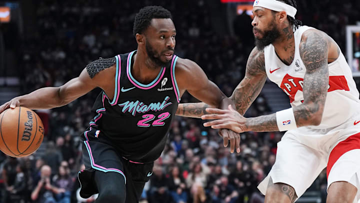 Apr 7, 2026; Toronto, Ontario, CAN; Miami Heat forward Andrew Wiggins (22) controls the ball as Toronto Raptors forward Brandon Ingram (3) defends during the first quarter at Scotiabank Arena. Mandatory Credit: Nick Turchiaro-Imagn Images