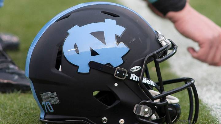 Dec 28, 2013; Charlotte, NC, USA; A North Carolina Tar Heels helmet lays on the field prior to the start of the game against the Cincinnati Bearcats in the Belk Bowl at Bank of America Stadium. Mandatory Credit: Jeremy Brevard-USA TODAY Sports Dec 28, 2013; Charlotte, NC, USA; A North Carolina Tar Heels helmet lays on the field prior to the start of the game against the Cincinnati Bearcats in the Belk Bowl at Bank of America Stadium. Mandatory Credit: Jeremy Brevard-USA TODAY Sports