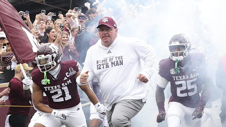 Texas A&M Aggies head coach Mike Elko takes the field prior to the game against the Miami Hurricanes during the first round of the CFP National Playoff at Kyle Field. Mandatory Credit: Maria Lysaker-Imagn Images
