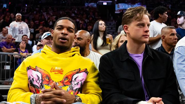 Feb 25, 2024; Phoenix, Arizona, USA; Cincinnati Bengals players Ja'Marr Chase (left) and Joe Burrow sit court side of the Phoenix Suns game against the Los Angeles Lakers at Footprint Center. Mandatory Credit: Mark J. Rebilas-USA TODAY Sports