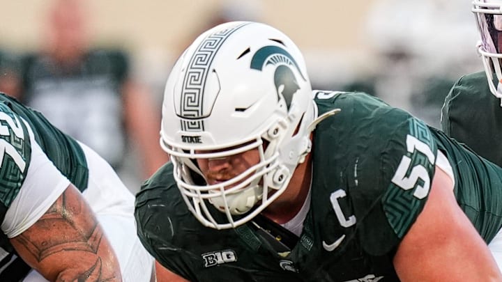 Michigan State quarterback Aidan Chiles (2) calls for a snap from offensive lineman Matt Gulbin (51) against Western Michigan during the first half at Spartan Stadium in East Lansing on Friday, August 29, 2025.