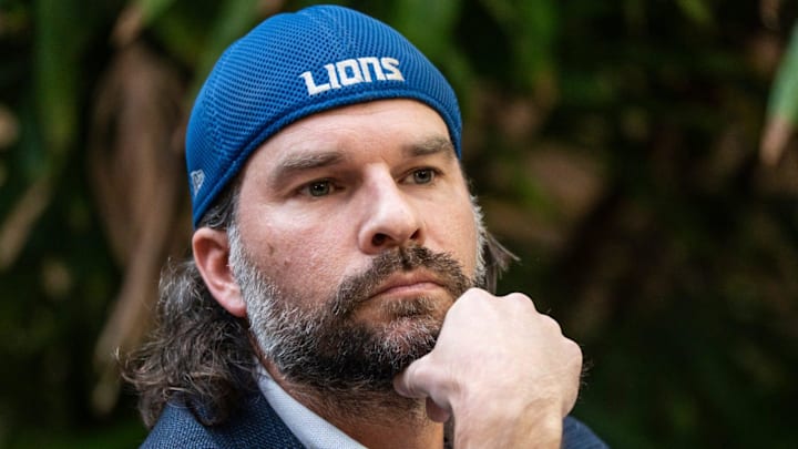 Detroit Lions fan Ryan Kennedy, center, listens during a media press conference 