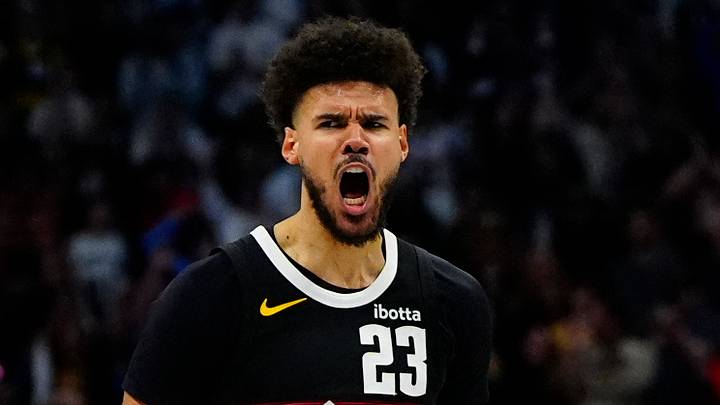 Apr 4, 2026; Denver, Colorado, USA; Denver Nuggets forward Cameron Johnson (23) reacts to his three point score in overtime against the San Antonio Spurs at Ball Arena. Mandatory Credit: Ron Chenoy-Imagn Images