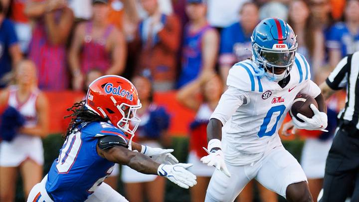 Mississippi Rebels wide receiver Johntay Cook II runs from Florida Gators defender Kanye Clark Mississippi Rebels wide receiver Johntay Cook II runs from Florida Gators defender Kanye Clark