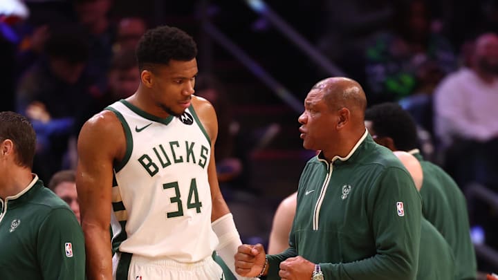Feb 6, 2024; Phoenix, Arizona, USA; Milwaukee Bucks head coach Doc Rivers talks to forward Giannis Antetokounmpo (34) against the Phoenix Suns at Footprint Center. Mandatory Credit: Mark J. Rebilas-Imagn Images