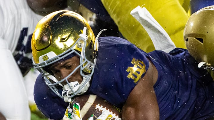 Notre Dame Fighting Irish running back Jadarian Price scores a touchdown against the Navy Midshipmen.