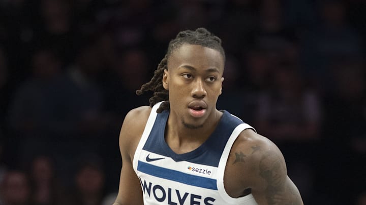 Mar 18, 2026; Minneapolis, Minnesota, USA; Minnesota Timberwolves guard Ayo Dosunmu (13) dribbles the ball against the Utah Jazz in the first half at Target Center. Mandatory Credit: Jesse Johnson-Imagn Images
