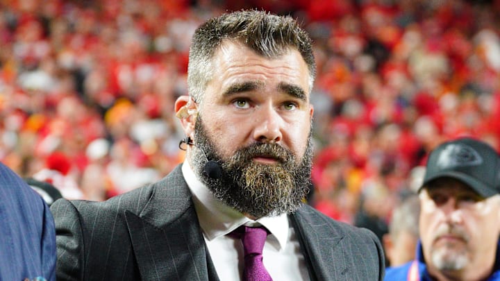 Former NFL star turned ESPN analyst Jason Kelce stands on the field before a game.