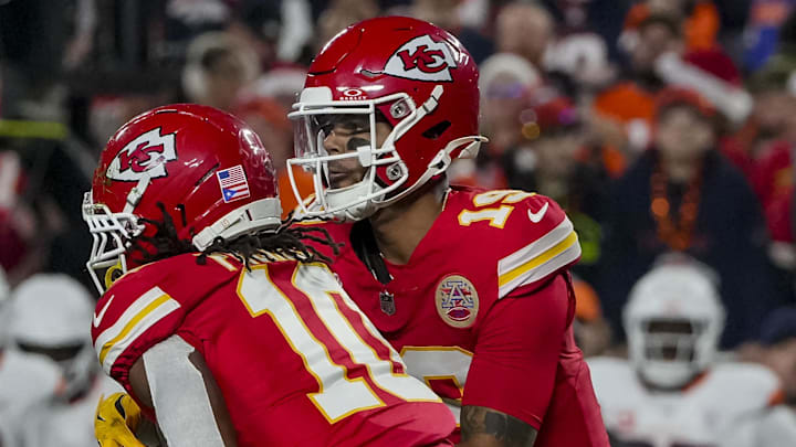 Kansas City Chiefs quarterback Chris Oladokun (19) hands the ball off to Kansas City Chiefs running back Isiah Pacheco (10)