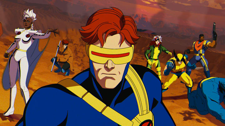 (L-R): Morph (voiced by JP Karliak), Storm (voiced by Alison Sealy-Smith), Gambit (voiced by AJ LoCascio), Cyclops (voiced by Ray Chase), Rogue (voiced by Lenore Zann), Wolverine (voiced by Cal Dodd), Bishop (voiced by Isaac Robinson-Smith), Beast (voiced by George Buza) in Marvel Animation's X-MEN '97. Photo courtesy of Marvel Animation. © 2024 MARVEL.