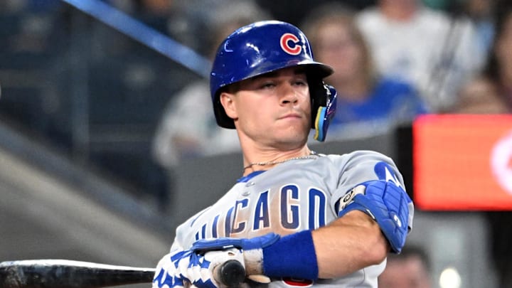 Aug 13, 2025; Toronto, Ontario, CAN;  Chicago Cubs third baseman Matt Shaw (6) leans away from a high inside pitch in the eighth inning against the Toronto Blue Jays at Rogers Centre. 