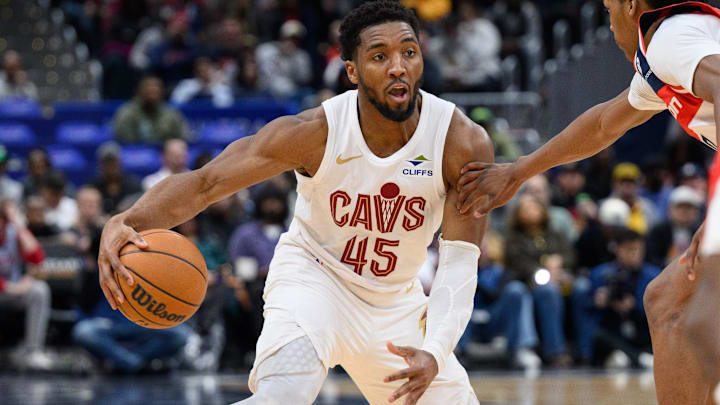 Feb 7, 2025; Washington, District of Columbia, USA; Cleveland Cavaliers guard Donovan Mitchell (45) hands the ball during the third quarter against the Washington Wizards at Capital One Arena. Mandatory Credit: Reggie Hildred-Imagn Images