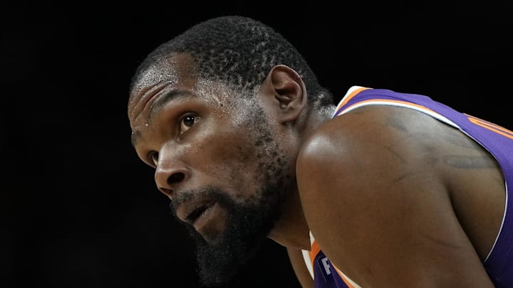Mar 17, 2025; Phoenix, Arizona, USA; Phoenix Suns forward Kevin Durant (35) during a timeout in the second half against the Toronto Raptors at Footprint Center. Mandatory Credit: Rick Scuteri-Imagn Images
