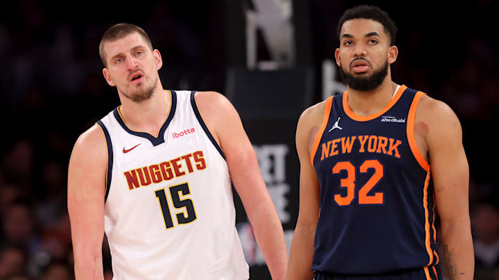 Jan 29, 2025; New York, New York, USA; Denver Nuggets center Nikola Jokic (15) and New York Knicks center Karl-Anthony Towns (32) react during the fourth quarter at Madison Square Garden.