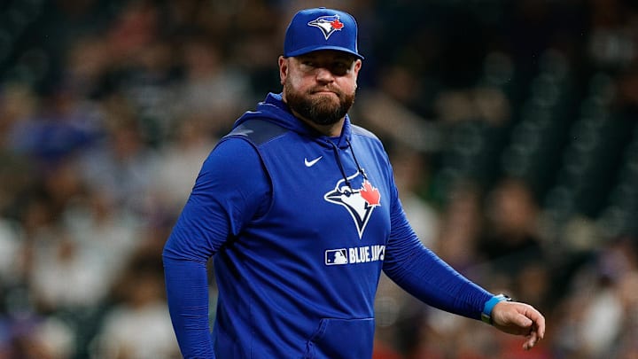 Aug 5, 2025; Denver, Colorado, USA; Toronto Blue Jays manager John Schneider (14) in the sixth inning against the Colorado Rockies at Coors Field. 