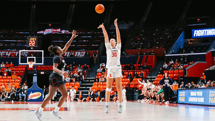 Illinois center Cearah Parchment (30) launches a three-pointer over a Jackson State defender in the Illini's 86-43 win against the Tigers on Dec. 19 at the State Farm Center in Champaign, Illinois.