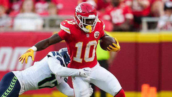 Kansas City Chiefs running back Emmett Johnson runs the ball against Seattle Seahawks cornerback Noah Igbinoghene during the preseason. Kansas City Chiefs running back Emmett Johnson runs the ball against Seattle Seahawks cornerback Noah Igbinoghene during the preseason.