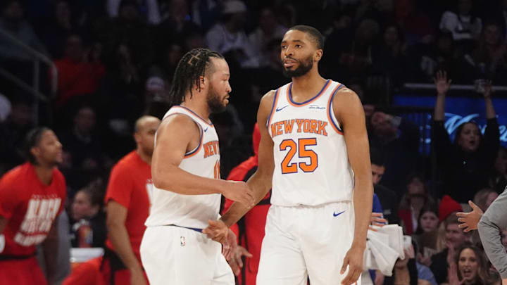 Feb 20, 2025; New York, New York, USA; New York Knicks point guard Jalen Brunson (11) slaps hands with forward Mikal Bridges (25) after he made a play against the Chicago Bulls during the first half at Madison Square Garden. Mandatory Credit: Gregory Fisher-Imagn Images