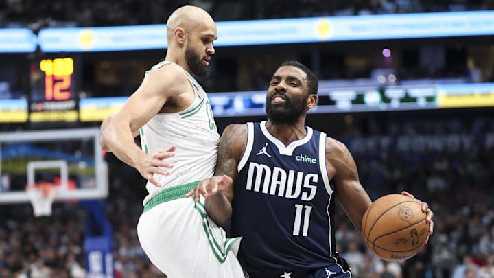 Jan 25, 2025; Dallas, Texas, USA;  Dallas Mavericks guard Kyrie Irving (11) drives to the basket as Boston Celtics guard Derrick White (9) defends during the first half at American Airlines Center. Mandatory Credit: Kevin Jairaj-Imagn Images
