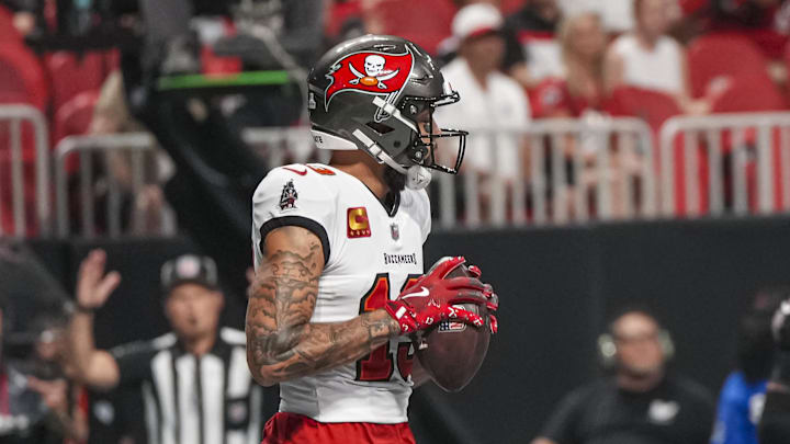 Oct 3, 2024; Atlanta, Georgia, USA; Tampa Bay Buccaneers wide receiver Mike Evans (13) catches a touchdown pass against the Atlanta Falcons during the first quarter at Mercedes-Benz Stadium. Mandatory Credit: Dale Zanine-Imagn Images