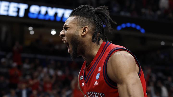 St. John's Red Storm forward Zuby Ejiofor (24) reacts after a dunk against the Duke Blue Devils in the second half during a Sweet Sixteen game of the East Regional of the men's 2026 NCAA Tournament at Capital One Arena, Mar 27, 2026. St. John's Red Storm forward Zuby Ejiofor (24) reacts after a dunk against the Duke Blue Devils in the second half during a Sweet Sixteen game of the East Regional of the men's 2026 NCAA Tournament at Capital One Arena, Mar 27, 2026.