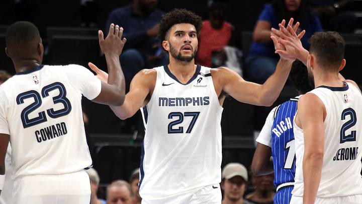 Oct 7, 2026; Memphis, Tennessee, USA; Memphis Grizzlies forward Cameron Boozer (27) reacts with forward Cedric Coward (23) and guard Ty Jerome (2) during the second quarter against the Orlando Magic at FedExForum. Mandatory Credit: Petre Thomas-Imagn Images Oct 7, 2026; Memphis, Tennessee, USA; Memphis Grizzlies forward Cameron Boozer (27) reacts with forward Cedric Coward (23) and guard Ty Jerome (2) during the second quarter against the Orlando Magic at FedExForum. Mandatory Credit: Petre Thomas-Imagn Images