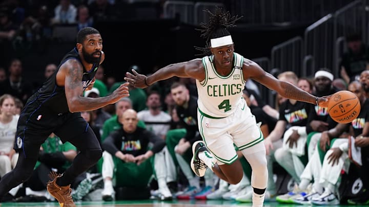 Jun 6, 2024; Boston, Massachusetts, USA; Boston Celtics guard Jrue Holiday (4) controls the ball against Dallas Mavericks guard Kyrie Irving (11) in the third quarter during game one of the 2024 NBA Finals at TD Garden. Mandatory Credit: David Butler II-USA TODAY Sports
