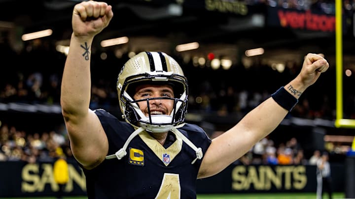 Nov 17, 2024; New Orleans, Louisiana, USA;  New Orleans Saints quarterback Derek Carr (4) reacts after tight end Taysom Hill (not pictured) scores a touchdown against the Cleveland Browns during the second half at Caesars Superdome. Mandatory Credit: Stephen Lew-Imagn Images